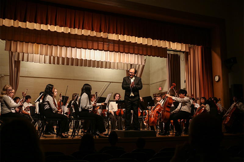 Simeone Tartaglione leads the Delaware Youth Symphony Orchestra strings