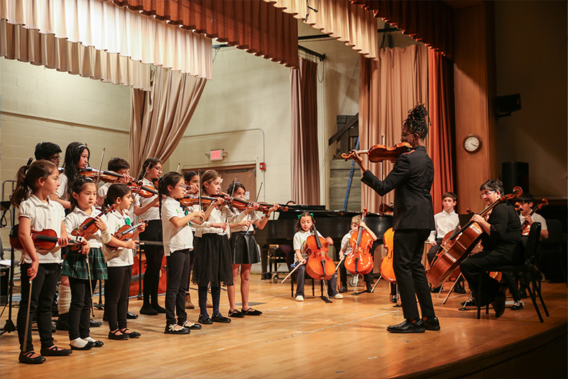 Suzuki Academy students with faculty member Lionel Thomas