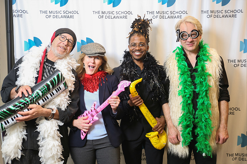 Faculty members (L-R) Paul Boris, Lionel Thomas, and Chris Braddock with Director of Development Jeana Beno